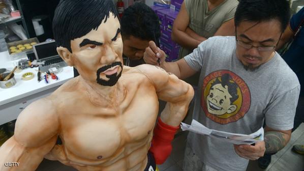 خباز يصنع كعكة بحجم الملاكم باكياو 1 كعكة