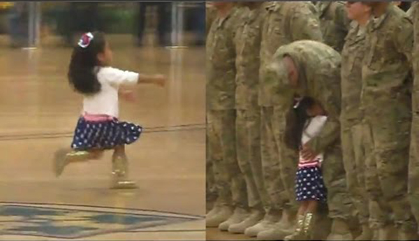 طفلة تخرق عرضا عسكريا لتعانق والدها