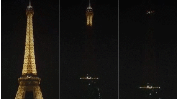 بالصور: حداداً على ضحايا باريس.. برج إيفل يكتسي السواد.. معالم حول العالم ترتدي ألوان العلم الفرنسي تضامناً 1 برج إيفل يكتسي السواد