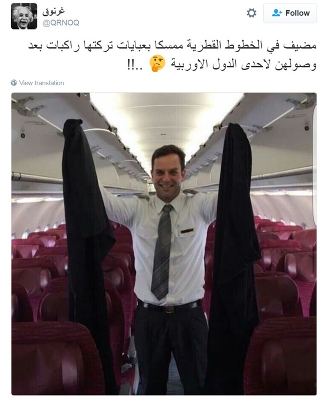 عباءات خليجيات في يد مضيف طيران تثير سخرية نشطاء تويتر وفيس بوك