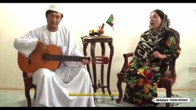صينى وزوجته يبدعون فى تقليد اغنية سودانية (يا بلدى يا حبوب).. فيديو 1 صيني وزوجته