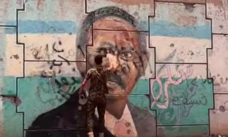 بالصورة والفيديو.. اثار غضب "القحاتة".. شاهد ماذا فعل شاب سوداني بصورة "حمدوك" المرسومة على جدار حائط بالخرطوم 1 b2920d33 8a93 42b2 8f84 576a99dae9e8